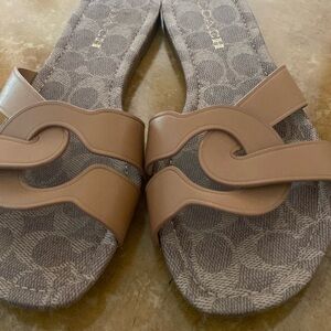 Coach Tan Leather Slide Sandals. 4 years young. Need more support in my shoes.